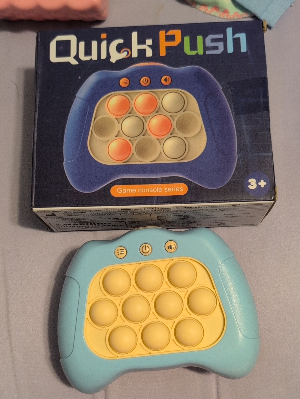 Quick Push Game Console Fidget Toy - Blue & Yellow